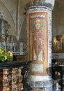 Fresco depicting Queen Theodelinda on a column close to the altar in the Church of Saint George in Varenna. Royalty Free Stock Photo