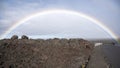 Full rainbow over a field of hardened lava on the Big Island, Hawaii.