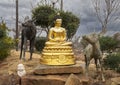 Gold colored statue of a Nyorai Buddha surrounded by deer at the Buddhist Center of Dallas, Texas. Royalty Free Stock Photo