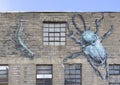 Mural with insects on the alleyway side of Larkin\'s Parkin in Benson at 6120 Military Avenue. Royalty Free Stock Photo