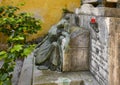 Sculpture of a woman in a small cemetary behind the Church of San Giorgio atop a hill in Portofino, Italy.