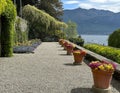 Gravel terrace with flowers and multiple plant species in the Villa Carlotta in Tremezzo.