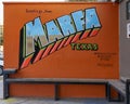 `Greetings from Marfa` mural by Katy Milam at Frama Coffee Shop in Marfa, Texas.