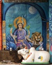 Hindu goddess, lion and Indian Brahman outside the Cosmic Cafe on Oak Lawn in Dallas, Texas. Royalty Free Stock Photo