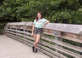 Seventeen year old hip teen posing on a wooden bridge in Washington Park Arboretum, Seattle, Washington Royalty Free Stock Photo