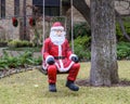 Statue of Santa Claus in a swing in Dallas, Texas