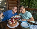 Husband enjoying his 75th birthday celebration with his wife.. Royalty Free Stock Photo