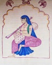 Indian woman playing a rudra veena outside the Cosmic Cafe on Oak Lawn in Dallas, Texas.