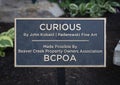 Information plaque for a bronze sculptures of a mother black bear and her cubs in Beaver Creek, Colorado.