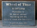 Information plaque for `Wheel of Time`, a stainless steel and dichroic glass piece by Jeff Laing in Edmond, Oklahoma.