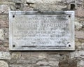 Plaque designating the home in which Giuseppe degli Aromatari was born on March 25th, 1587 in Assisi, Italy.