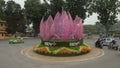 Flowers and abstract light purple geometric installation in a traffic circle in hanoi, vietnam Royalty Free Stock Photo