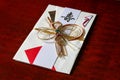 Japanese special envelope for monetary gifts on the lacquered board Royalty Free Stock Photo