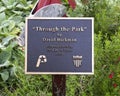 Information plaque for `Through the Park` by David Hickman in Haggard Park in downtown Plano, Texas.