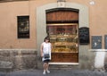 Korean woman on holiday in Rome debating a pastry purchase