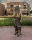 Life-size bronze sculpture of Anadarko chief by Linda Lewis, part of an art piece titled `The Peace Circle` in historic Grapevine.