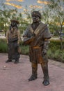 Life-size bronze sculpture of two chiefs by Linda Lewis, part of an art piece titled `The Peace Circle` in historic Grapevine.