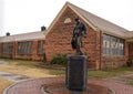 Life size Bronze sculpture of Russell Dougherty by Edmond artist Mary Lou Gresham in Edmond, Oklahoma.