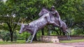 Cowboy on horseback, a bronze sculpture by Anita Pauwels, part of a public art installation titled `Cattle Drive` in Central Park