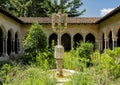 The limestone cross with Apostles in the Trei Cloister Garden in New York City.
