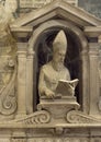 Marble statue of a bishop or pope inside the monumental Orvieto Cathedral in Orvieto, Italy.