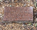 Memorial stone for `Teacher With Heart`, a metal sculpture by John Dennard located at Dowell Middle School in McKinney, Texas. Royalty Free Stock Photo