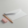 Pictured is a minimalist composition featuring a white envelope, a wooden pencil with Royalty Free Stock Photo