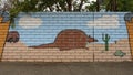 Mural on a barrier wall between Forest Lane and the neighborhood on the North side, painted in 1976 by art students.