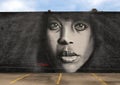 Mural of Erykah Badu by renowned artist Ponchaveli on the outside wall of a building near Fair Park in Dallas, Texas