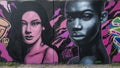 Mural featuring two beautiful woman`s faces at the Fabrication Yard in Dallas, Texas, by renowned artist Jeremy Biggers.