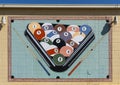 Mural featuring an oversized rack of pool balls on a pool table with two cues on an outside wall of a business in Fort Worth. Royalty Free Stock Photo