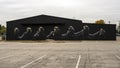 Six black men mural by Jeremy Biggers for the Wild West Mural Fest 2020 in West Dallas, Texas.