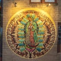 Mural featuring the Virgin of Guadalupe by Steve Hunter on the outside of a building in Oak Cliff, Dallas, Texas.