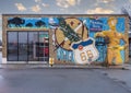 Mural on the side of a building on Route 66 in Tulsa, Oklahoma, filled with Tulsa icons.