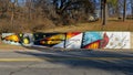 Mural titled `Explore the Adventures of Fayetteville` by Jeremy Navarette in Fayetteville, Arkansas.