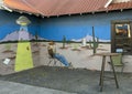 Pictured is a mural to the left of  the entrance to Se Vende, a shop with only a vending machine inside in Marfa, Texas. Royalty Free Stock Photo