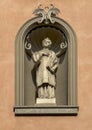 Niche statue of Saint Stephen on the facade of the Church of Saint Stephen in Menaggio on Lake Como.