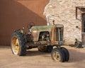 Oliver 770 row-crop tractor on display in front of the old historic Lewisville Feed Mill in Lewisville, Texas.