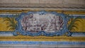 Blue, yellow and green azulejo tile panels on the side walls of the refectory of the Jeronimos Monastery in Lisbon, Portugal.