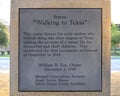 One of four plaques on `Walking to Texas` by sculptor Michael Cunnigham in the historic district of Grapevine, Texas. Royalty Free Stock Photo
