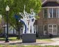 Figurative steel sculpture by Joshua Weiner on 15th Street in Plano, Texas.