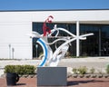 Figurative steel sculpture by Joshua Weiner on 15th Street in Plano, Texas.