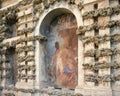 One of several frescoes by Diego Esquivel in the textured wall behind the Mercury pond in the gardens of Real Alcazar in Seville.