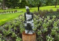 Opal stone sculpture titled Bookreader by Jonothan Mhondorohuma in the Fort Worth Botanic Garden. Royalty Free Stock Photo