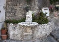 Ornate drinking fountain with small statue of a cherub holding a dolphin, Marina Grande, Sorrento