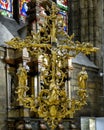 Ornate gold sculpture Jesus Christ on the Cross inside the Milan Cathedral, the cathedral church of Milan, Lombardy, Italy.