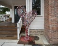 Heart-shaped sculpture featuring multiple locks of all types and sizes on an iron frame in the Bishop Arts District of Oak Cliff.