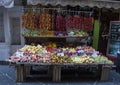 An small outdoor store with fruits and vegetables on a narrow street in Sorrento, Italy