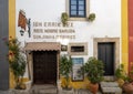 Bar Ibn Errik Rex on Obidos cobbled main street, the Rua Direita. Royalty Free Stock Photo