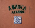 Painted tile representing Fado on an outside wall of the small fado restaurant Baiuca in Alfama. Royalty Free Stock Photo